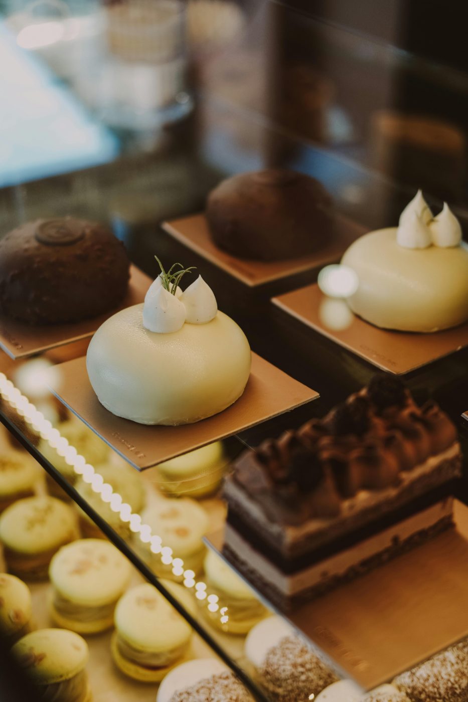 Boutique patisserie display of decorated cakes