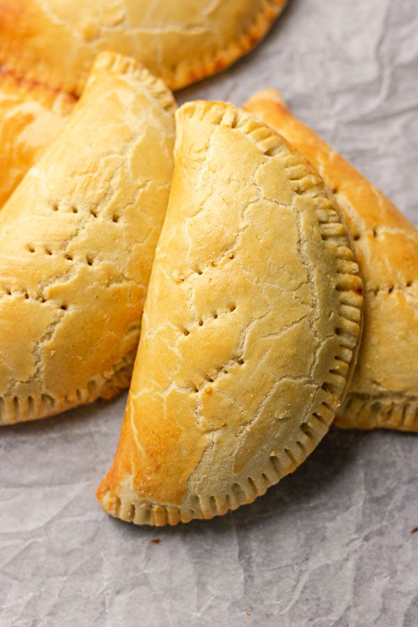 Golden Nigerian meat pies with crimped edges